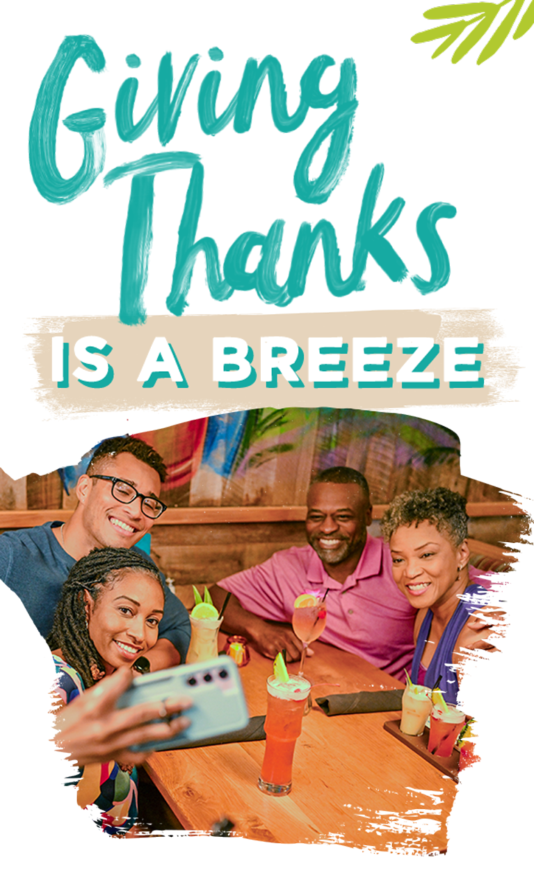 Giving Thanks is a Breeze - A family celebrating together at Bahama Breeze, taking a selfie while enjoying tropical drinks in a warm, festive atmosphere