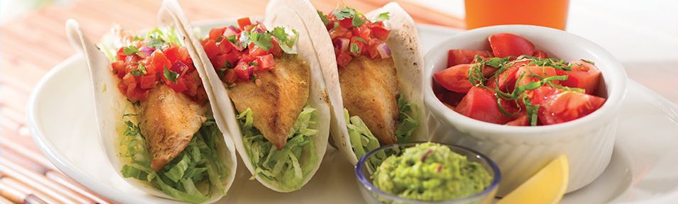 Key West Fish Tacos Three fish tacos with tomato salsa and jicama slaw and a side of guacamole